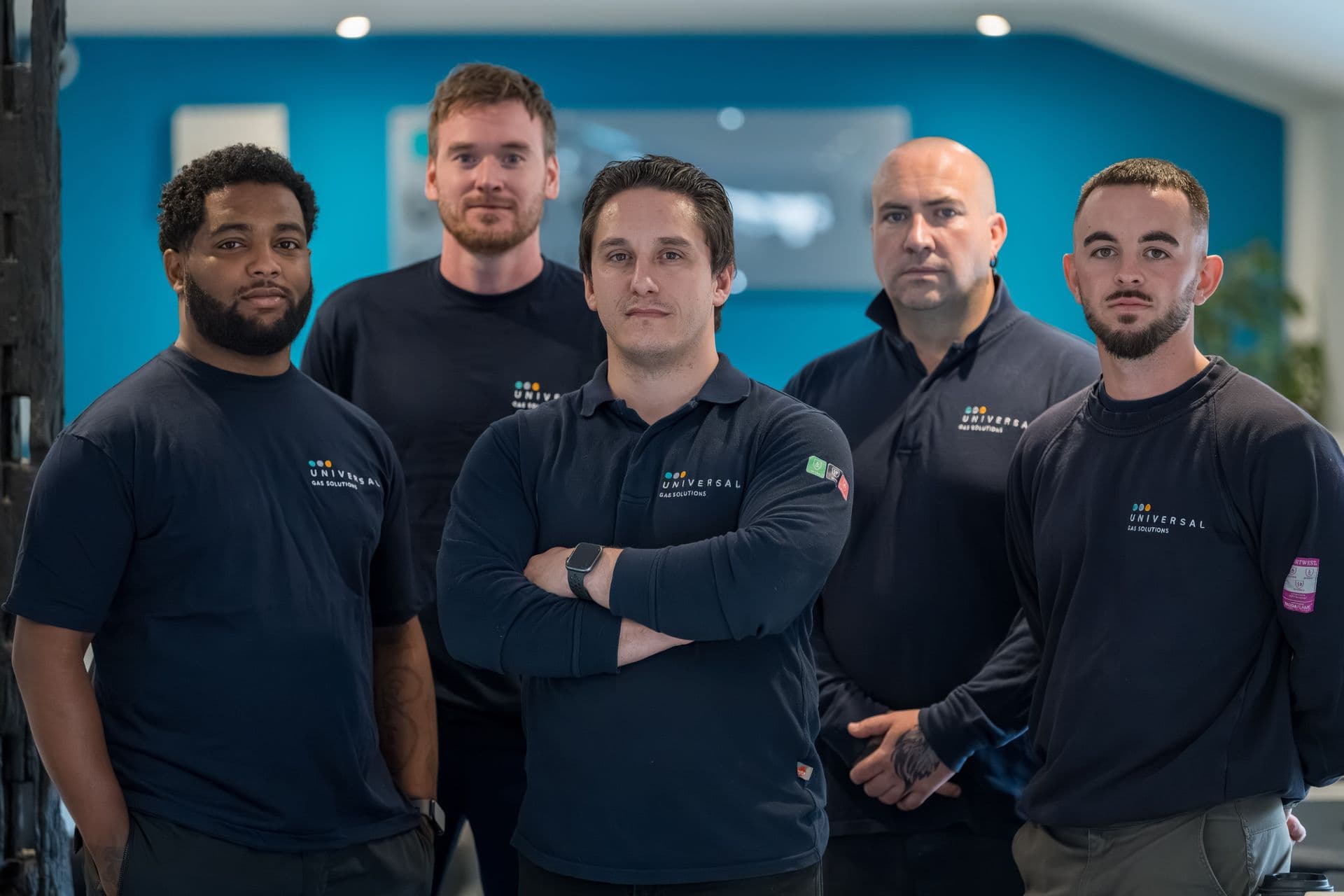 Five Universal Gas engineers in branded uniform